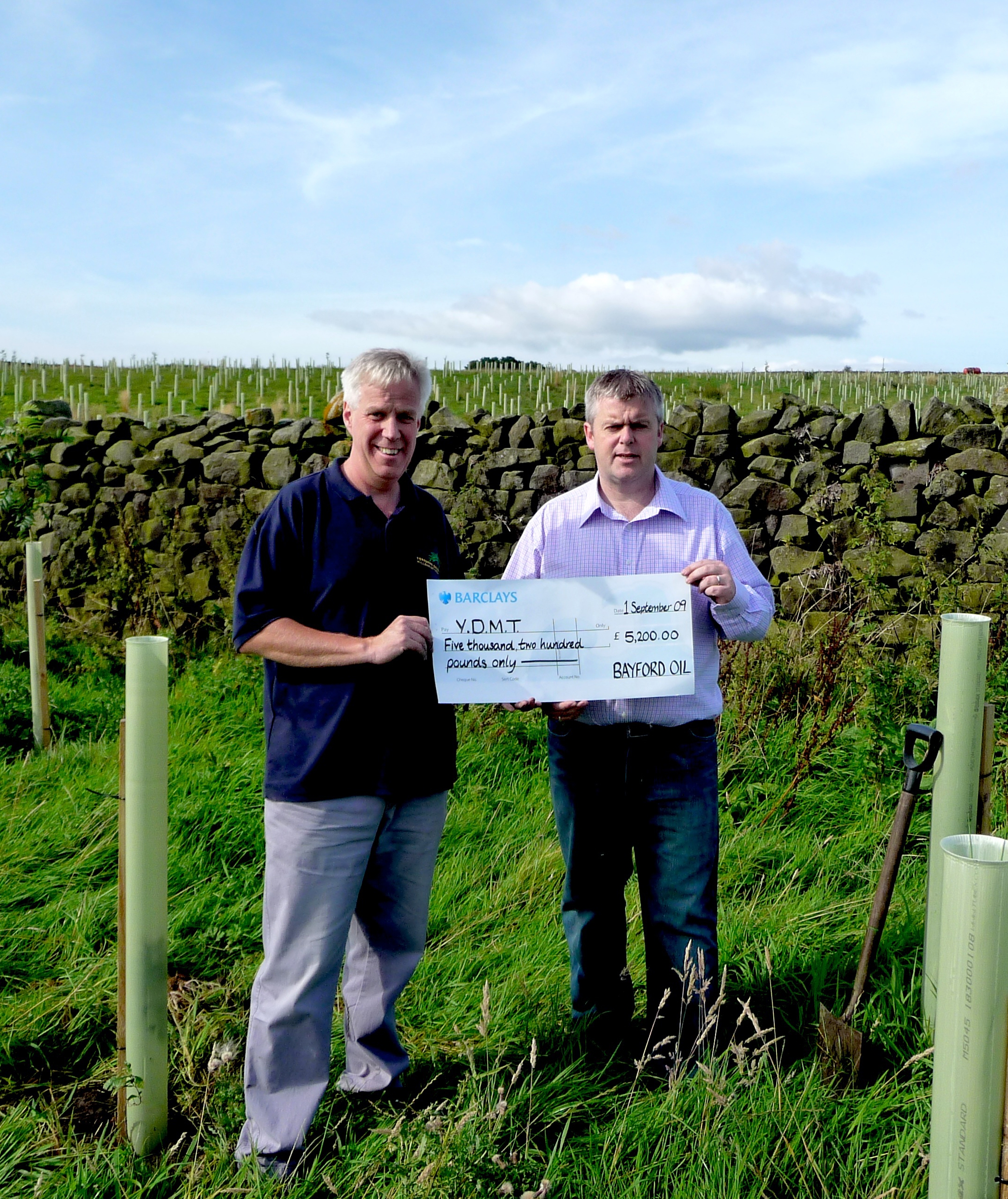 Rob Staines Director of Bayford (Right) presents giant cheque to our Director David Sharrod. 