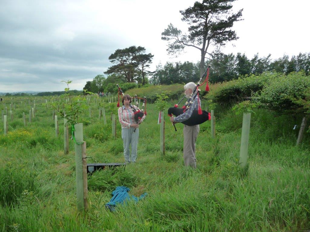 Bagpipers play at Greenwood Leghe Wood