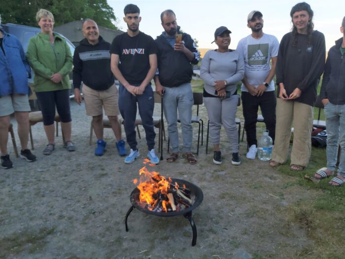DARE members round a camp fire